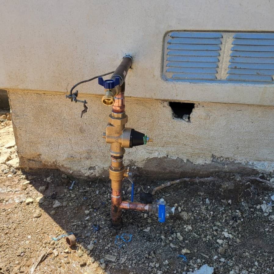 Outdoor sewer cleanout access with surrounding soil excavation